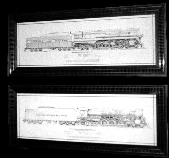 Framed technical drawings of locomotives by artist Bill Berkompas
